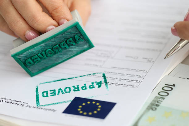 EU visa application approved. Document applying for entry into European Union EU visa application approved. Getting Schengen visa concept schengen agreement photos stock pictures, royalty-free photos & images