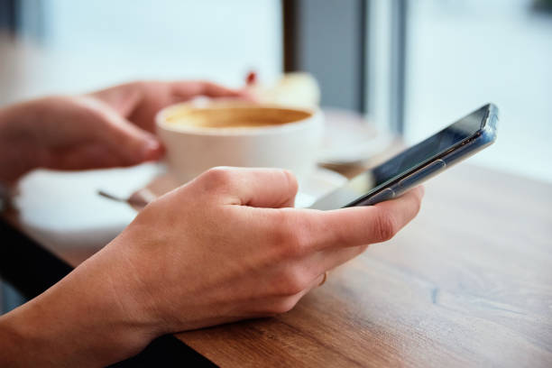 istock Woman have breakfast at cafe, use smartphone at cafe 1369074327