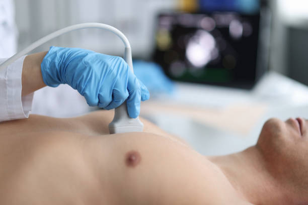 Doctor performs chest ultrasound on man in hospital closeup Doctor performs chest ultrasound on man in hospital room. Examination of the heart and vessels concept ultrasound stock pictures, royalty-free photos & images