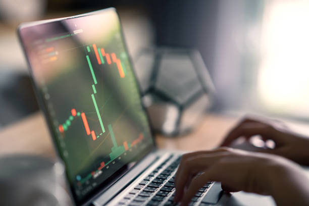 istock Hand of woman is checking Bitcoin price chart on digital exchange on computer, cryptocurrency future price action prediction. 1369075665
