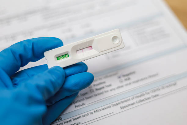 istock Doctor holding Negative test result coronavirus by using rapid test device for COVID-19 virus, novel coronavirus 2019 found in Wuhan, China 1369075804