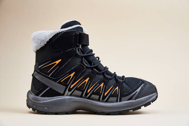 istock Male winter shoe on beige background 1369076666