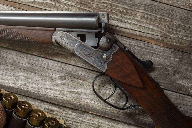 istock Hunting rifle and hunting accessories on the table. 1369076745