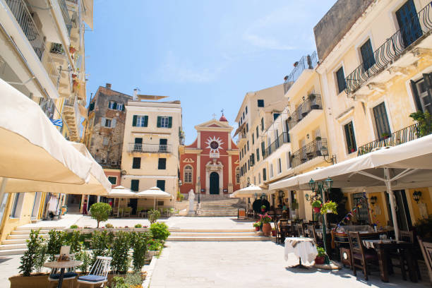 Charming street with cafes, Corfu, Greece View of Corfu town, Greece corfu town stock pictures, royalty-free photos & images