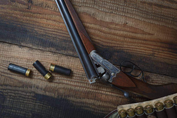 istock Hunting rifle and hunting accessories on the table. 1369076900