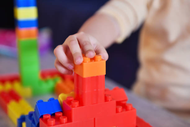 istock Little baby playing on table with colroful toys. 1369078066