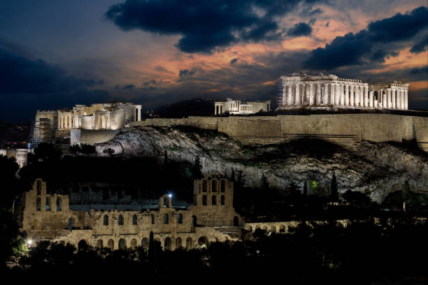 View from below: the Parthenon, temple on the Athenian Acropolis, dedicated to the maiden goddess Athena. Famous UNESCO world heritage in the Greek capital Athens, in Attica, Greece, Southeast Europe. Place of worship on top of the hill. Large historical background with space for additional text message.