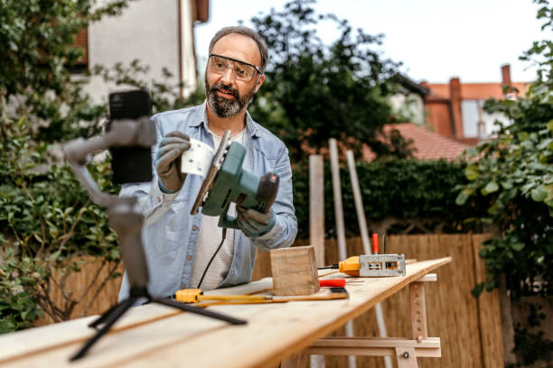 istock Mature man showing sander while vlogging on smart phone 1369080309