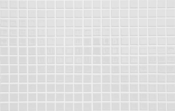 istock White or gray ceramic wall and floor tiles abstract background. Design geometric mosaic texture decoration of the bedroom. Simple seamless pattern for backdrop hospital wall, canteen and grid paper. 1369080439
