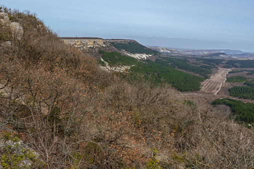 View of valley from mountain plateau Burunchak near cavetown Chufut-Kale in spring. Bakhchysarai, Crimea