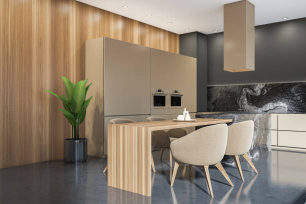 istock Corner view on dark kitchen room interior with double oven 1369080631