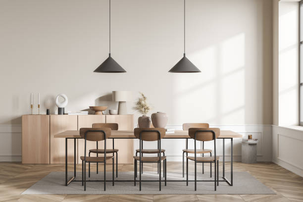istock Light guest room interior with six seats and table, drawer with decoration 1369080658