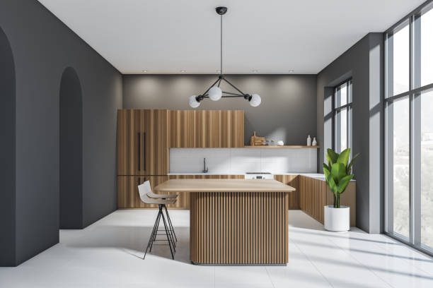 istock Dark and wooden kitchen set interior with table and bar chairs, panoramic window 1369082160