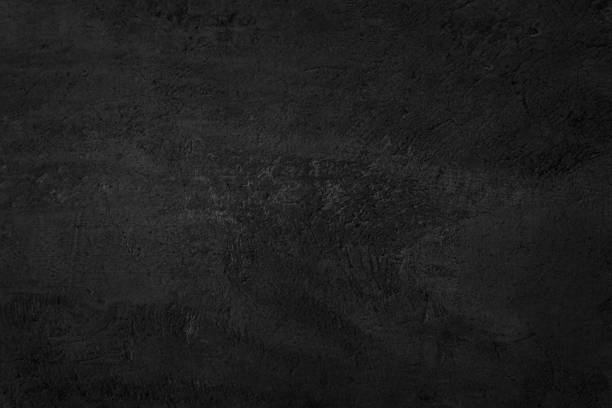 istock Close up retro plain dark black cement & concrete wall background texture for show or advertise or promote product and content on display. 1369082534