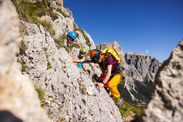 istock Alpine mountain guide teaching how to climb to hiking group 1369082603