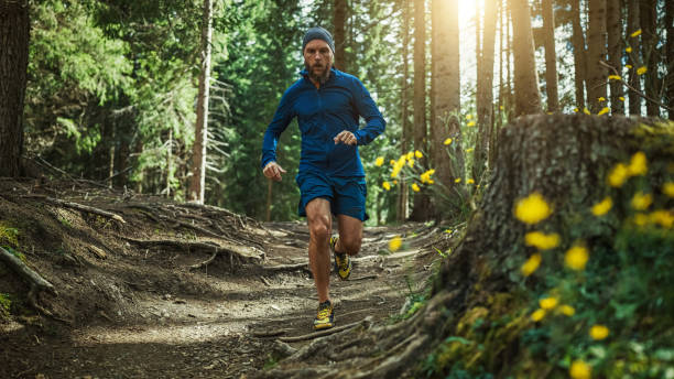 istock Man trail running in the forest 1369083177