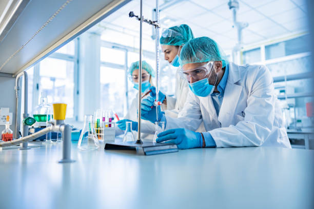 istock Team of scientists working on scientific research in laboratory. 1369083261