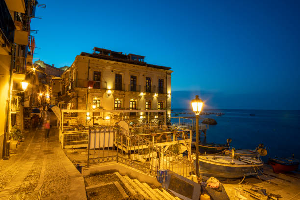 Scilla is a town and comune in Calabria, Italy, administratively part of the Metropolitan City of Reggio Calabria on the shores of the Tyrrhenian Sea. Scilla is a town and comune in Calabria, Italy, Metropolitan City of Reggio Calabria on September 8, 2021. Scilla's coastal district of Chianalea is included in the I Borghi più belli d'Italia by night. castle scilla stock pictures, royalty-free photos & images