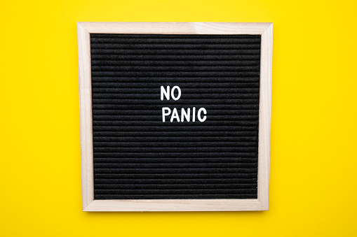 Don T Panic test on a felt board on a yellow background.