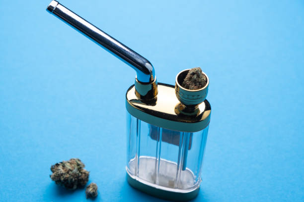 istock Hookah with marijuana on a blue background close-up 1369090087