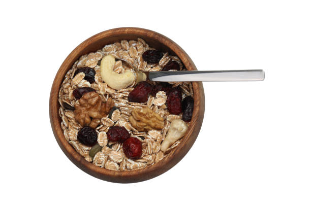 Cereal with cereal nuts, apple and berries
