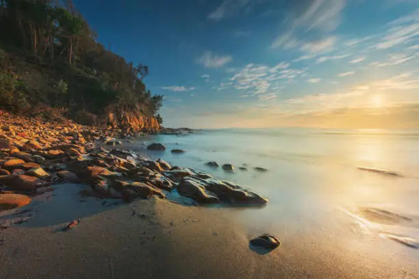 Photo of Cala Violina beach in Maremma at sunset, Tuscany. Mediterranean sea. Italy.