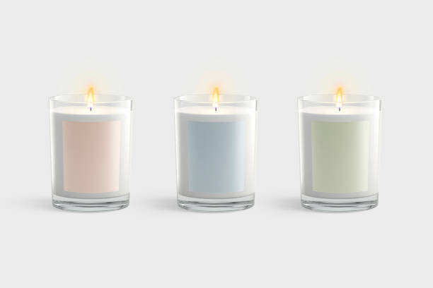 istock Blank white candle in glass jar with colored label mockup 1369098097