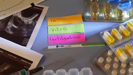 IVF or in vitro fertilisation, reproductive assisted technology, infertility or sterility treatment. Ultrasound or ultrasonography, pregnancy test, syringe and pills. Hormonal drugs for stimulation.