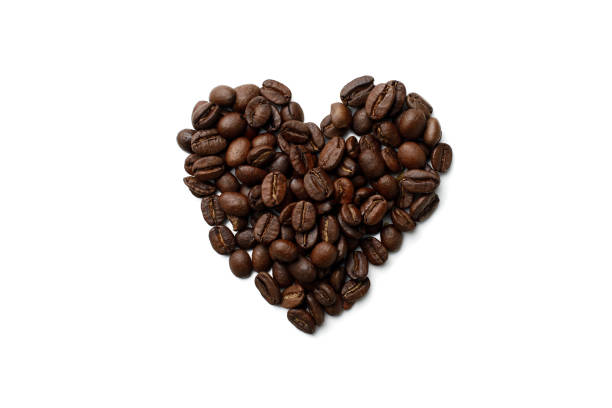 istock Heart shaped coffee beans, top view, white isolated background. 1369098879