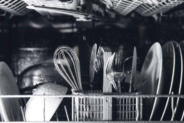 istock Open dishwasher with clean utensil inside, cutlery, glasses, dishes at kitchen 1369100178