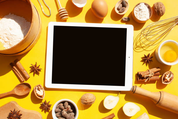 istock Cooking gingerbread cookies. Ingredients and kitchen items on a yellow background. Flat lay style 1369100990