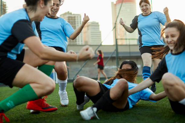 istock A team runs together after scoring a goal. 1369101388
