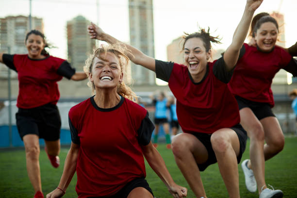 istock A team runs together after scoring a goal. 1369101396