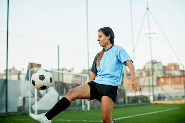 istock A skilled female soccer player is controlling the ball. 1369101424