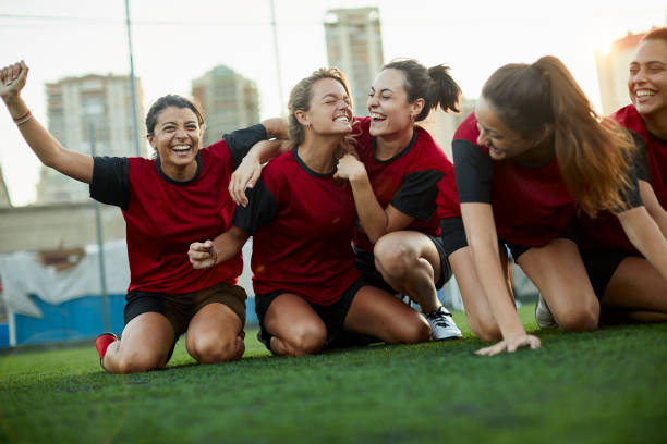 istock A team runs together after scoring a goal. 1369101425