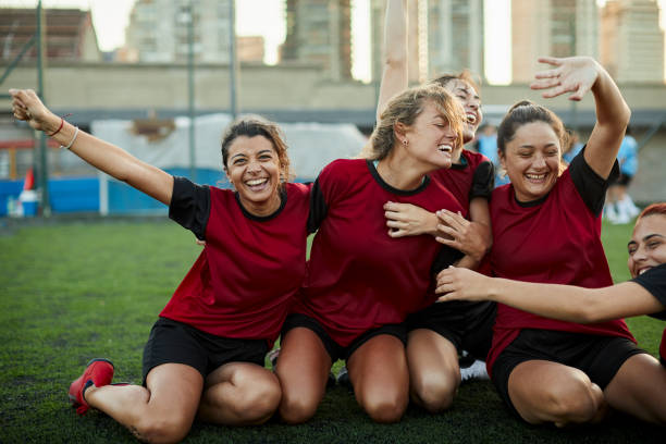 istock A team runs together after scoring a goal. 1369101443