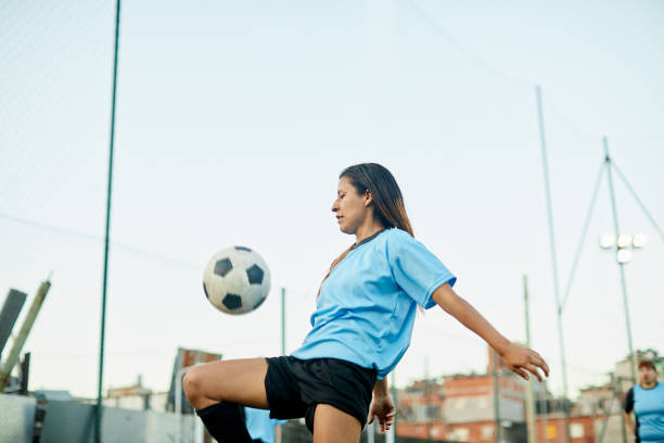 istock A skilled female soccer player is controlling the ball. 1369101450