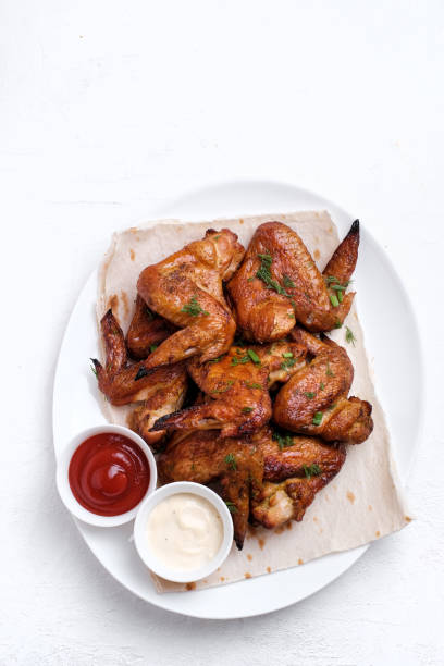 istock Plate of barbecue chicken wings. Top view. 1369101512
