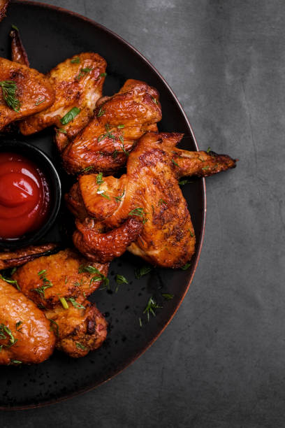 istock Plate of barbecue chicken wings. Top view. 1369101556