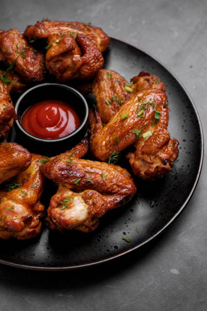 istock Plate of barbecue chicken wings. Top view. 1369101570