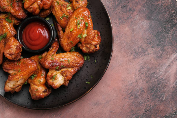 istock Plate of barbecue chicken wings. Top view. 1369101572