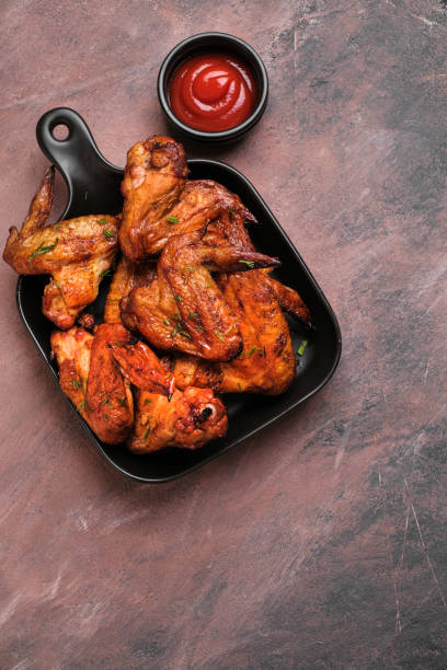 istock Plate of barbecue chicken wings. Top view. 1369101590