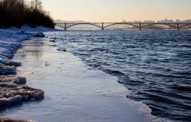 istock Melting ice on the river in spring. Ice drift time. Natural structure. Needles in the sun. 1369102862