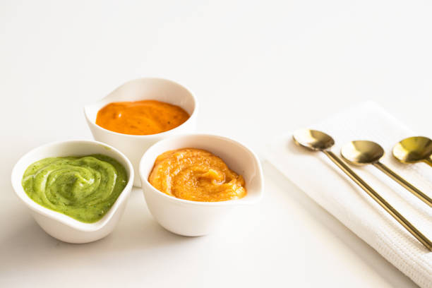 istock Three typical Canary Islands sauces, mojo picon, mojo verde  and almogrote  in ceramic bowl on modern restaurant table 1369103942