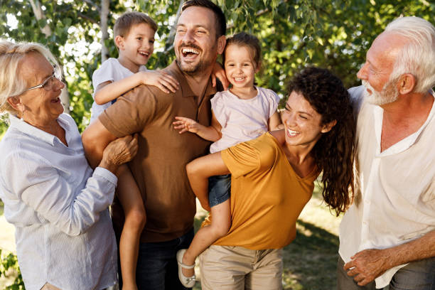 istock Cheerful extended family having fun in nature. 1369103968