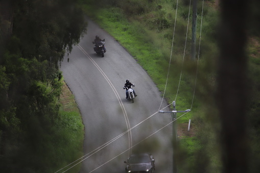 Motorcyclist on country road aerial