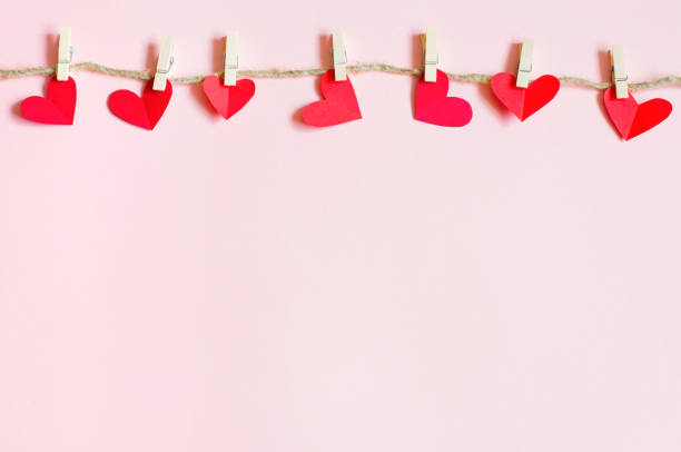 istock Valentine's Day concept, paper hearts hanging on clothespins 1369105338