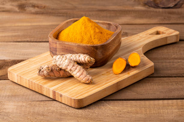 istock Fresh Organic Root And Turmeric Powder - Curcuma Longa 1369105674
