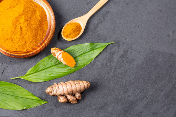 istock Fresh Organic Root And Turmeric Powder - Curcuma Longa 1369105683