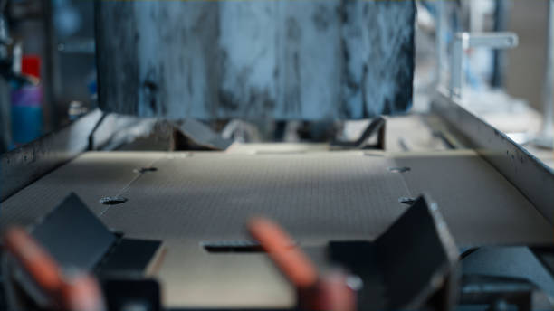 istock Closeup cardboard packing production process conveyor system line concept 1369107072